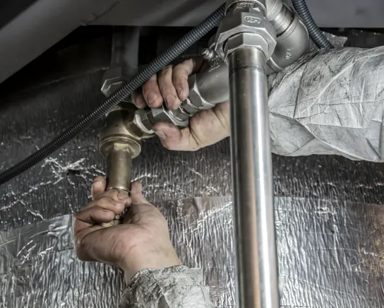 Testing valves and thermostat on a hot water unit in Blacktown